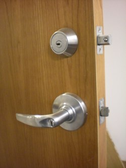 Mul-t-lock Hercular deadbolt and Schlage lever retrofitted with Mul-t-lock high security cylinder